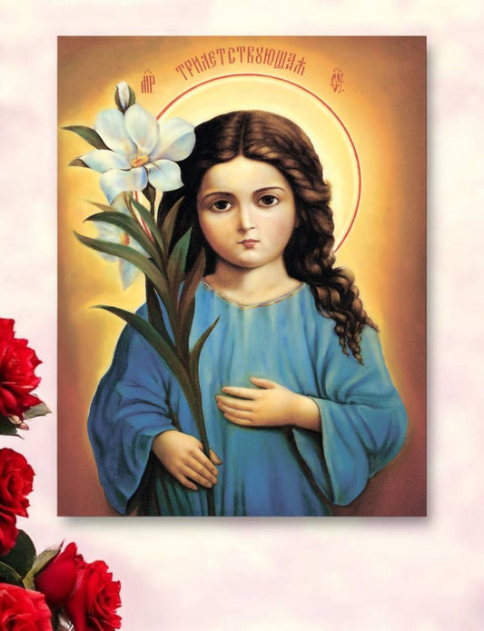 Wooden icon of the Virgin Mary at the age of three, holding a white lily, symbolizing purity and holiness.