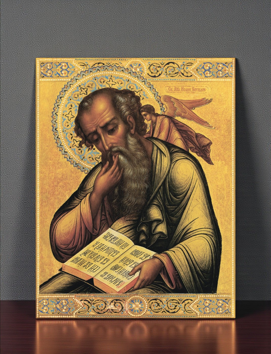 Christian icon of John the Theologian author of Revelation
Handmade Orthodox icon of Apostle John with angel by his side