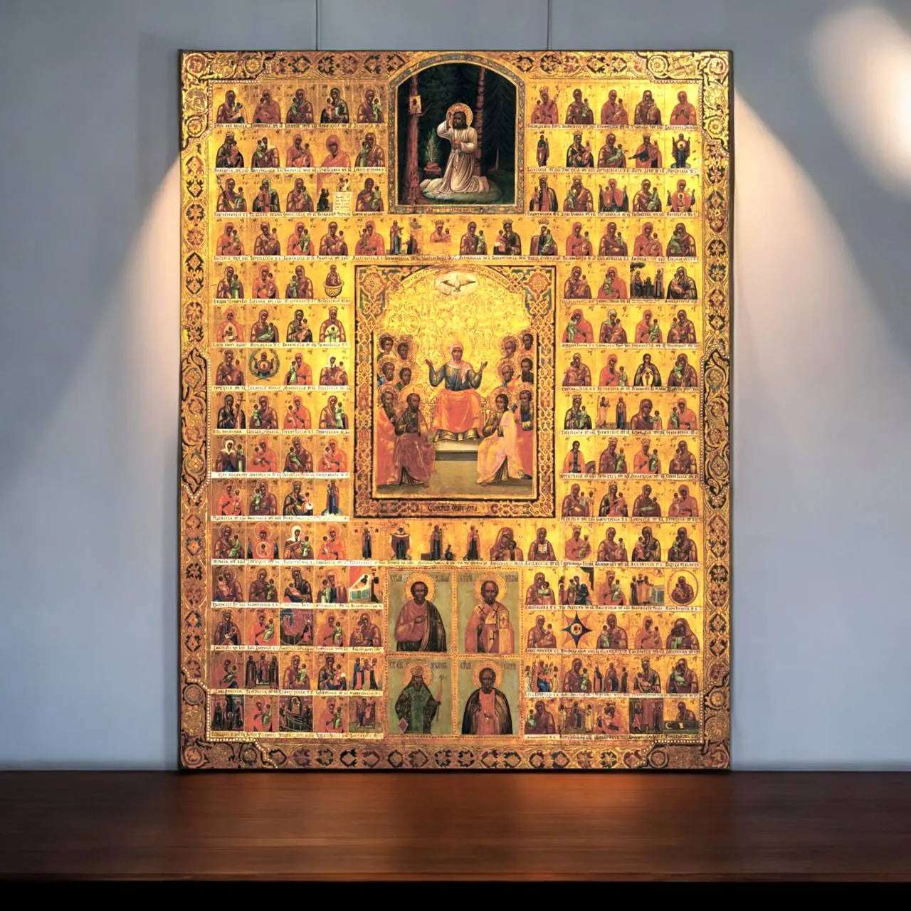 Antique wooden panel icon featuring a grand collection of Orthodox Theotokos depictions, central saints, and biblical events.