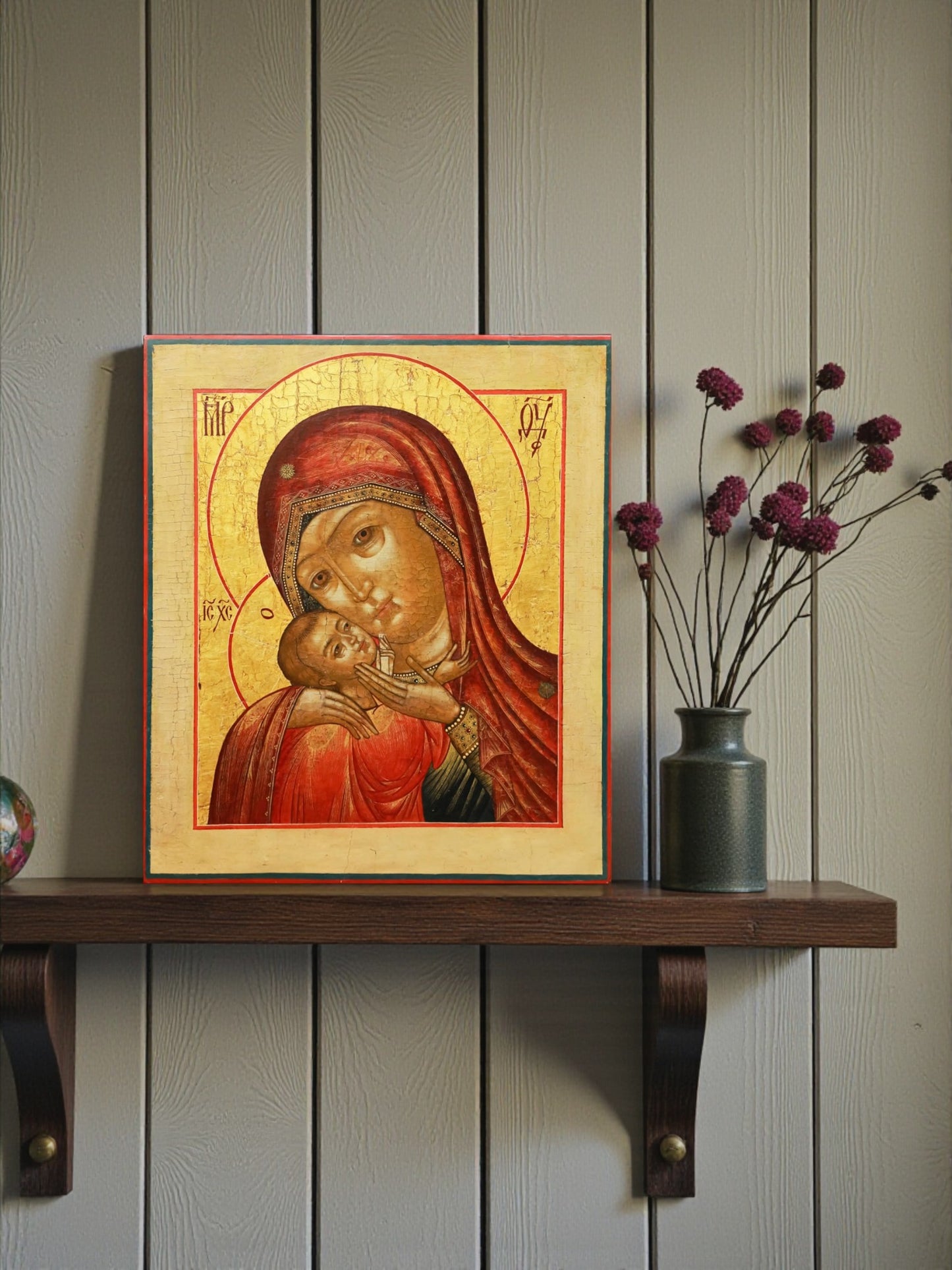 The icon belongs to the iconographic type Eleusa ("Tenderness" or "Compassion") in its abbreviated, shoulder-length variant, where the Mother of God and Christ Child are shown in a tender maternal embrace, symbolizing God's love for humanity.