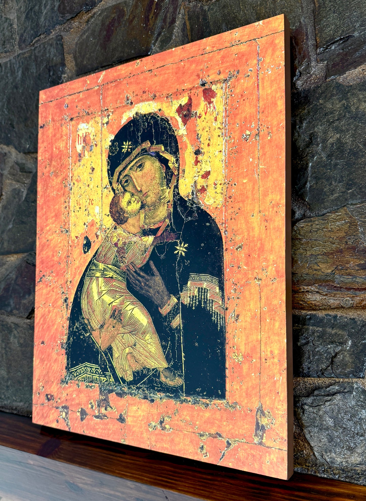 Religious wall art depicting the Virgin Mary embracing the Christ Child.