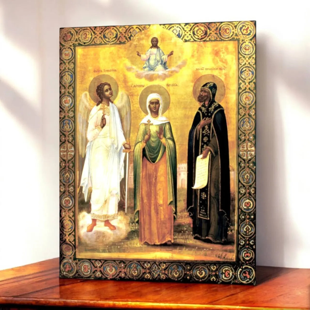 Christian icon of the Holy Martyr Natalia holding a cross, flanked by a Guardian Angel and Saint Procopius