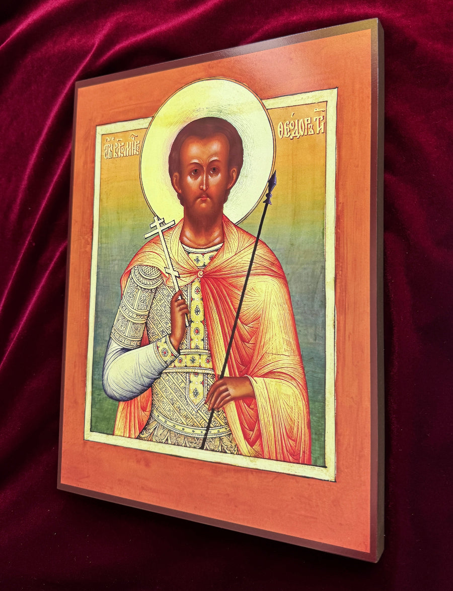 Believers pray before the icon of Saint Theodore the Tyro for courage in trials, steadfast faith, victory over fear and temptation, and spiritual strength.