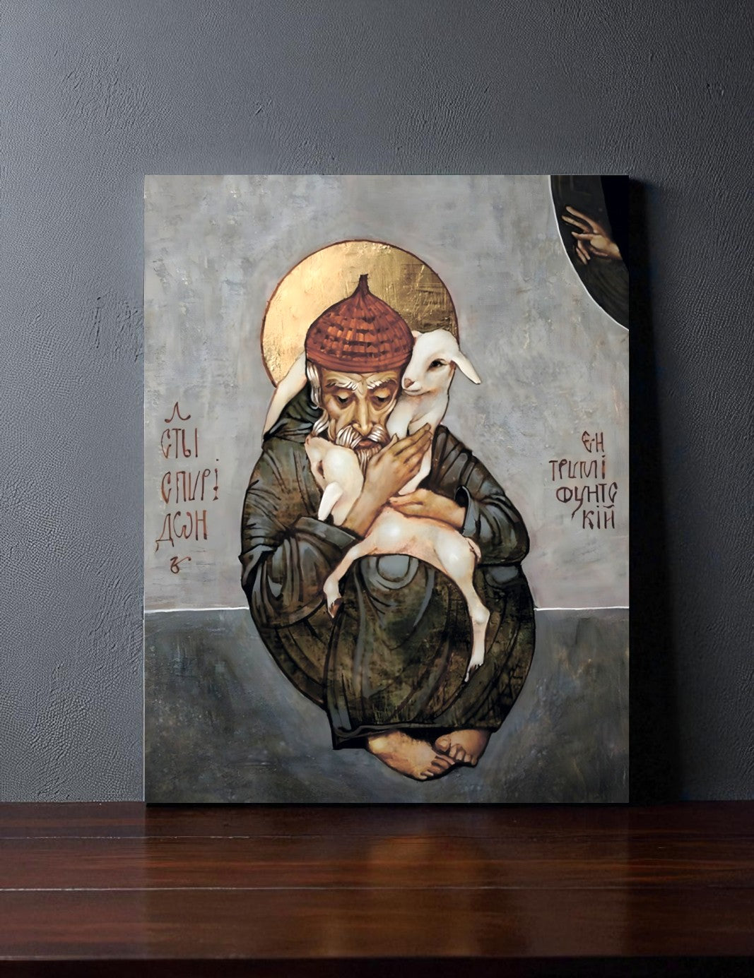 Wooden Orthodox icon of Saint Spyridon embracing sheep, symbol of pastoral care.