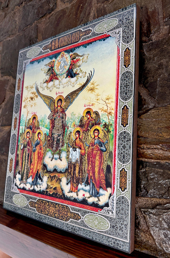 Decorative icon with religious figures and angels on a stone wall background