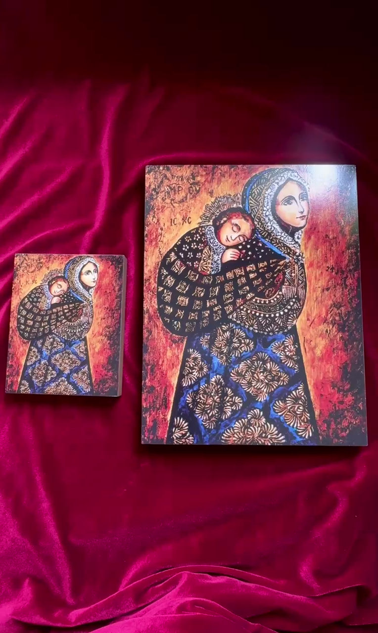 Mother of God icon with Baby Jesus wrapped in cloth against her shoulder